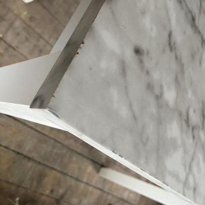 Sale Photo Thumbnail #389: Table has a top that is wrapped to look like granite.  The wrap is pealing along the edges and the table top has some chips in it.