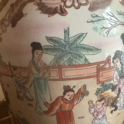 Sale Photo Thumbnail #103: These are a pair of vintage Chinese-style porcelain ginger jar table lamps, featuring hand-painted Chinoiserie motifs of figures and florals on a wooden base.