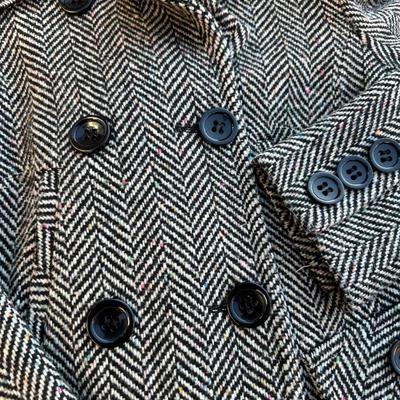 Sale Photo Thumbnail #401: Juniors' single-breasted walker coat in a black and white herringbone pattern.