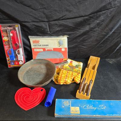 Cast Iron skillet - Ekco Flint cutlery set - rooster hot pads - Weber kettle cover - clock n flame lighters and more