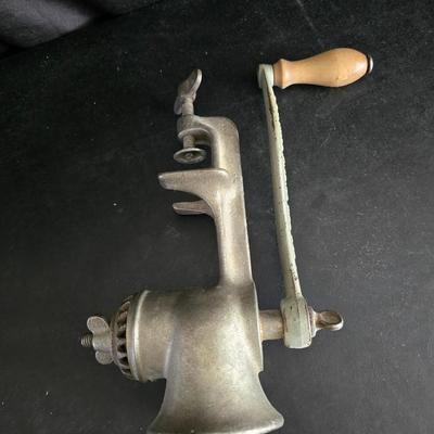 Vintage meat grinder - hand mixer - and an assortment of other kitchen items used on the farm