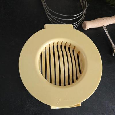 Vintage meat grinder - hand mixer - and an assortment of other kitchen items used on the farm