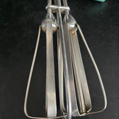 Vintage meat grinder - hand mixer - and an assortment of other kitchen items used on the farm