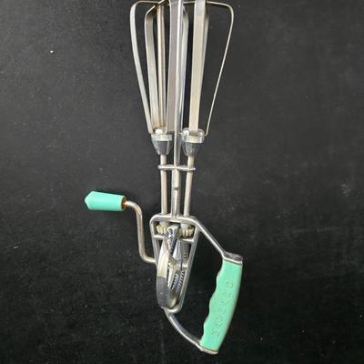 Vintage meat grinder - hand mixer - and an assortment of other kitchen items used on the farm