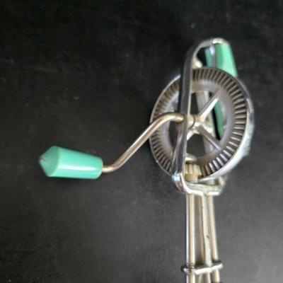Vintage meat grinder - hand mixer - and an assortment of other kitchen items used on the farm