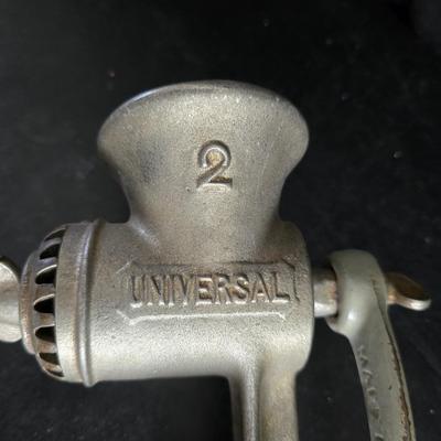 Vintage meat grinder - hand mixer - and an assortment of other kitchen items used on the farm