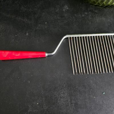 Vintage meat grinder - hand mixer - and an assortment of other kitchen items used on the farm