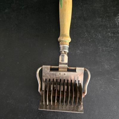 Vintage meat grinder - hand mixer - and an assortment of other kitchen items used on the farm