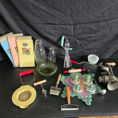 Vintage meat grinder - hand mixer - and an assortment of other kitchen items used on the farm