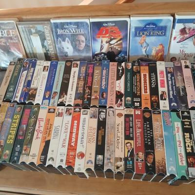 Huge library of VHS tapes = All kinds of GREAT movie titles!