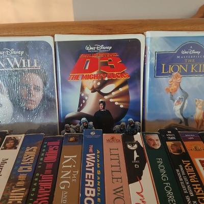 Huge library of VHS tapes = All kinds of GREAT movie titles!