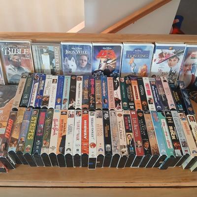 Huge library of VHS tapes = All kinds of GREAT movie titles!