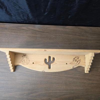 Decorative wooden shelf with cactus and two small wooden boxes also wood burned to match