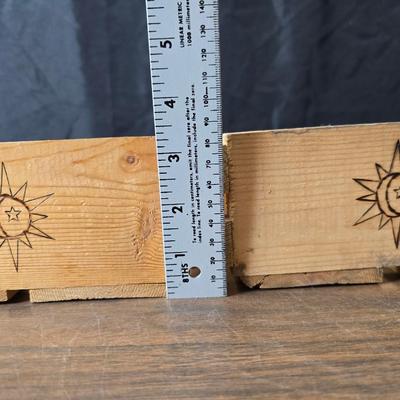 Decorative wooden shelf with cactus and two small wooden boxes also wood burned to match