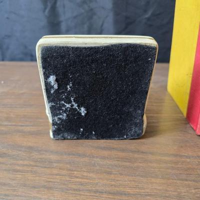 Universal Statuary Corp. mid-century chalkware bookends, featuring a floral design with an assortment of old books