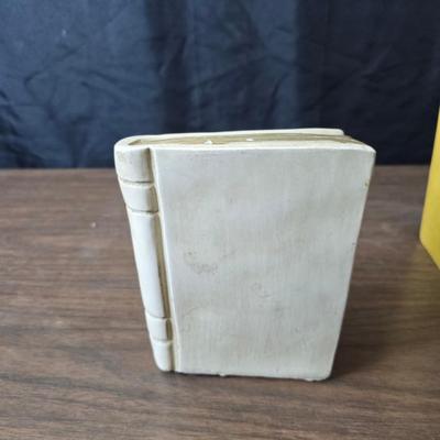 Universal Statuary Corp. mid-century chalkware bookends, featuring a floral design with an assortment of old books