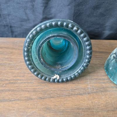 Old glass insulators and three vintage cast iron scale weights
