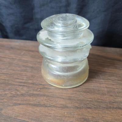 Old glass insulators and three vintage cast iron scale weights