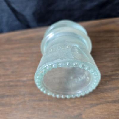 Old glass insulators and three vintage cast iron scale weights