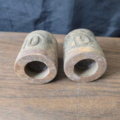 Old glass insulators and three vintage cast iron scale weights
