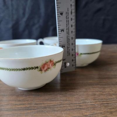Mid Century French Petitie Choses Brass Candle Holder with a variety of vintage floral China plates