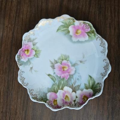 Mid Century French Petitie Choses Brass Candle Holder with a variety of vintage floral China plates