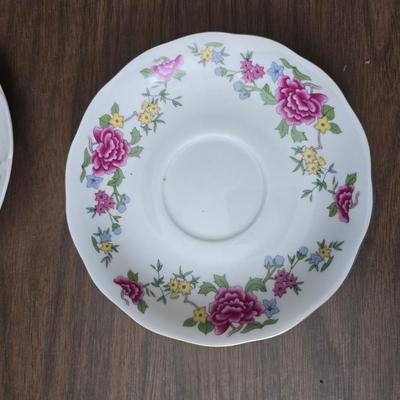 Mid Century French Petitie Choses Brass Candle Holder with a variety of vintage floral China plates