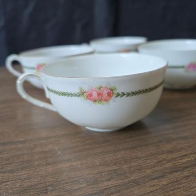 Mid Century French Petitie Choses Brass Candle Holder with a variety of vintage floral China plates