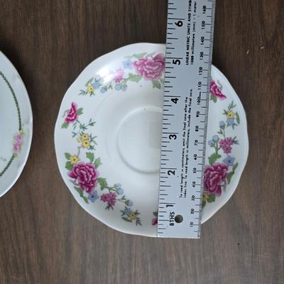 Mid Century French Petitie Choses Brass Candle Holder with a variety of vintage floral China plates