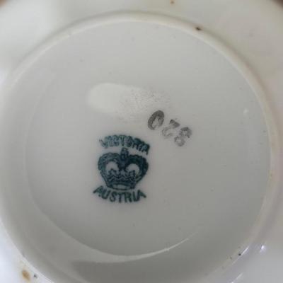 Mid Century French Petitie Choses Brass Candle Holder with a variety of vintage floral China plates