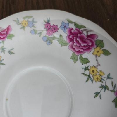 Mid Century French Petitie Choses Brass Candle Holder with a variety of vintage floral China plates