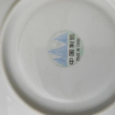 Mid Century French Petitie Choses Brass Candle Holder with a variety of vintage floral China plates