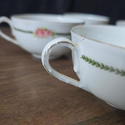 Mid Century French Petitie Choses Brass Candle Holder with a variety of vintage floral China plates