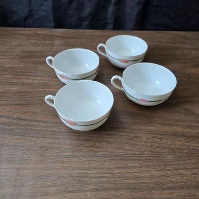 Mid Century French Petitie Choses Brass Candle Holder with a variety of vintage floral China plates