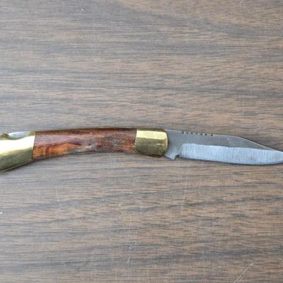 Vintage Remington target thrower for clay shooting and a pocket knife