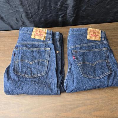 Two pair of red leather tag Levi 501 jeans Size 38 x 33 like new!