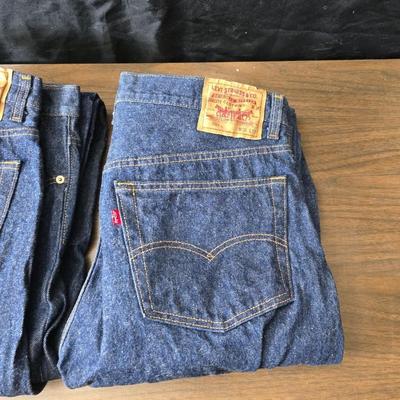 Two pair of red leather tag Levi 501 jeans Size 38 x 33 like new!