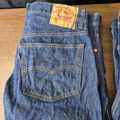 Two pair of red leather tag Levi 501 jeans Size 38 x 33 like new!