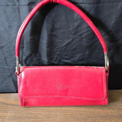 Two red purses - Gucci made in Italy - and Clarks
