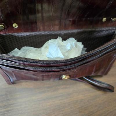 Crocodile skin like purses - large black one and a brown one with a small white wallet