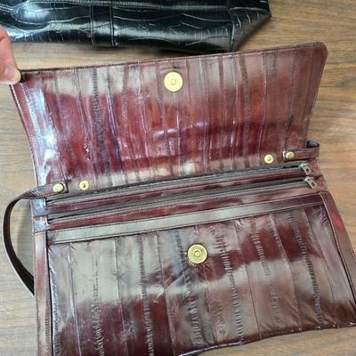 Crocodile skin like purses - large black one and a brown one with a small white wallet