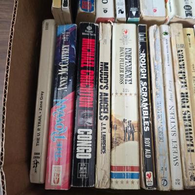 Boxes of softcover books - all different genres -