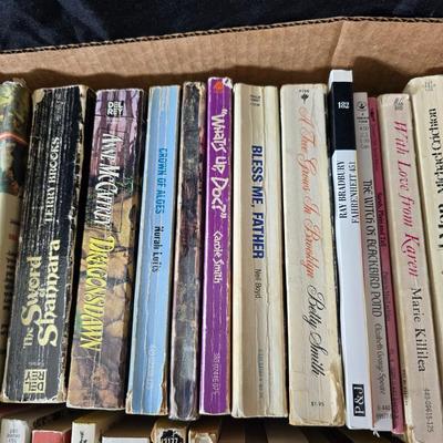 Boxes of softcover books - all different genres -