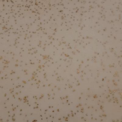 vintage Mid-Century Modern 2-tier end tables featuring blonde wood and speckled gold glitter Formica tops.