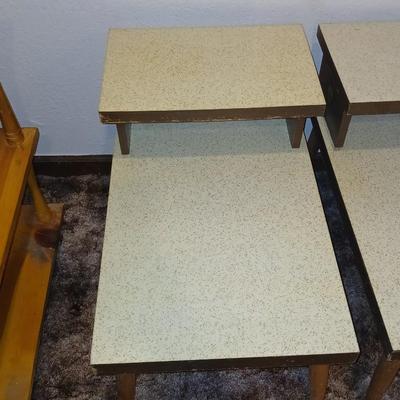 vintage Mid-Century Modern 2-tier end tables featuring blonde wood and speckled gold glitter Formica tops.