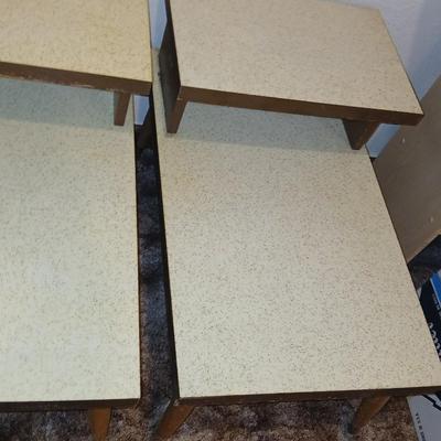 vintage Mid-Century Modern 2-tier end tables featuring blonde wood and speckled gold glitter Formica tops.