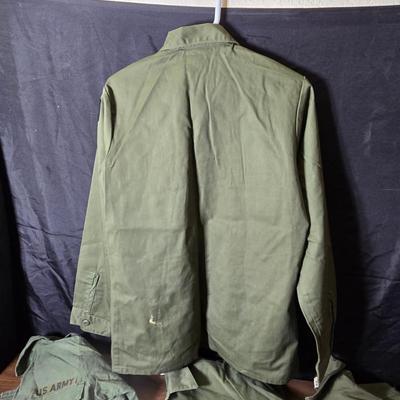 Collection of US Army OG-107 or OG-507 utility uniforms, including shirts and trousers. - See photos for size