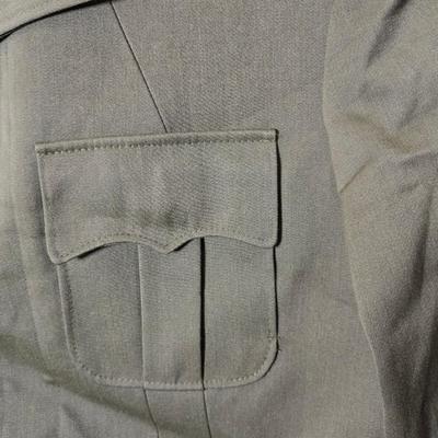a collection of U.S. Army WWII-era wool Eisenhower, or "Ike", jacket and field shirt