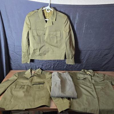 a collection of U.S. Army WWII-era wool Eisenhower, or "Ike", jacket and field shirt
