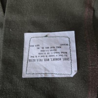 a collection of U.S. Army WWII-era wool Eisenhower, or "Ike", jacket and field shirt